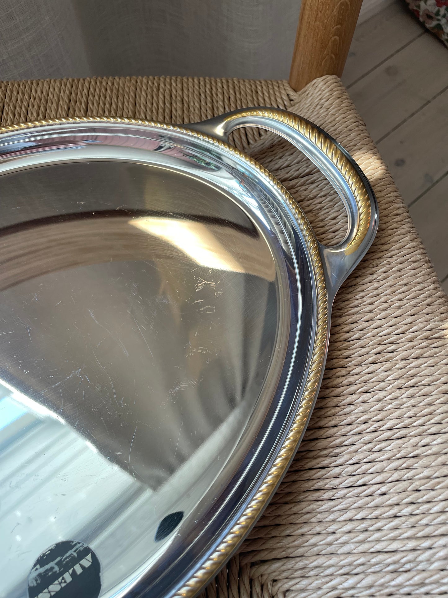 Alessi steel dish with twisted gold edge