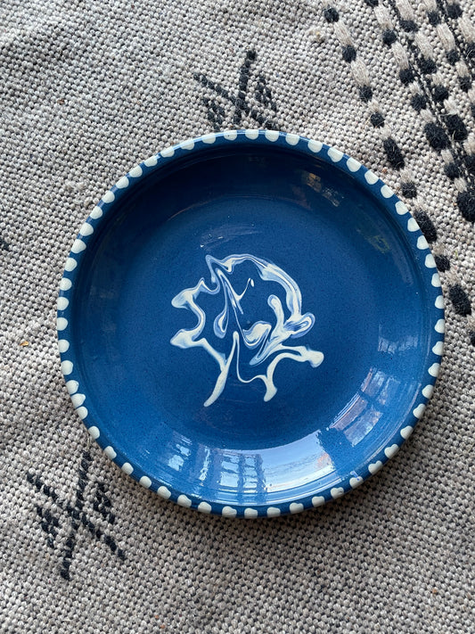 Earthenware dish with blue glaze