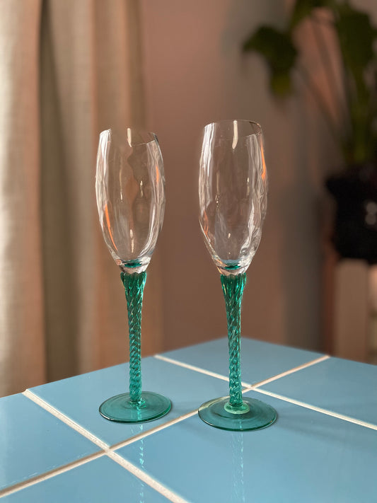 Champagne glass with green twisted foot