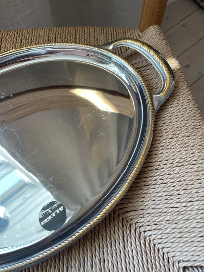 Alessi steel dish with twisted gold edge