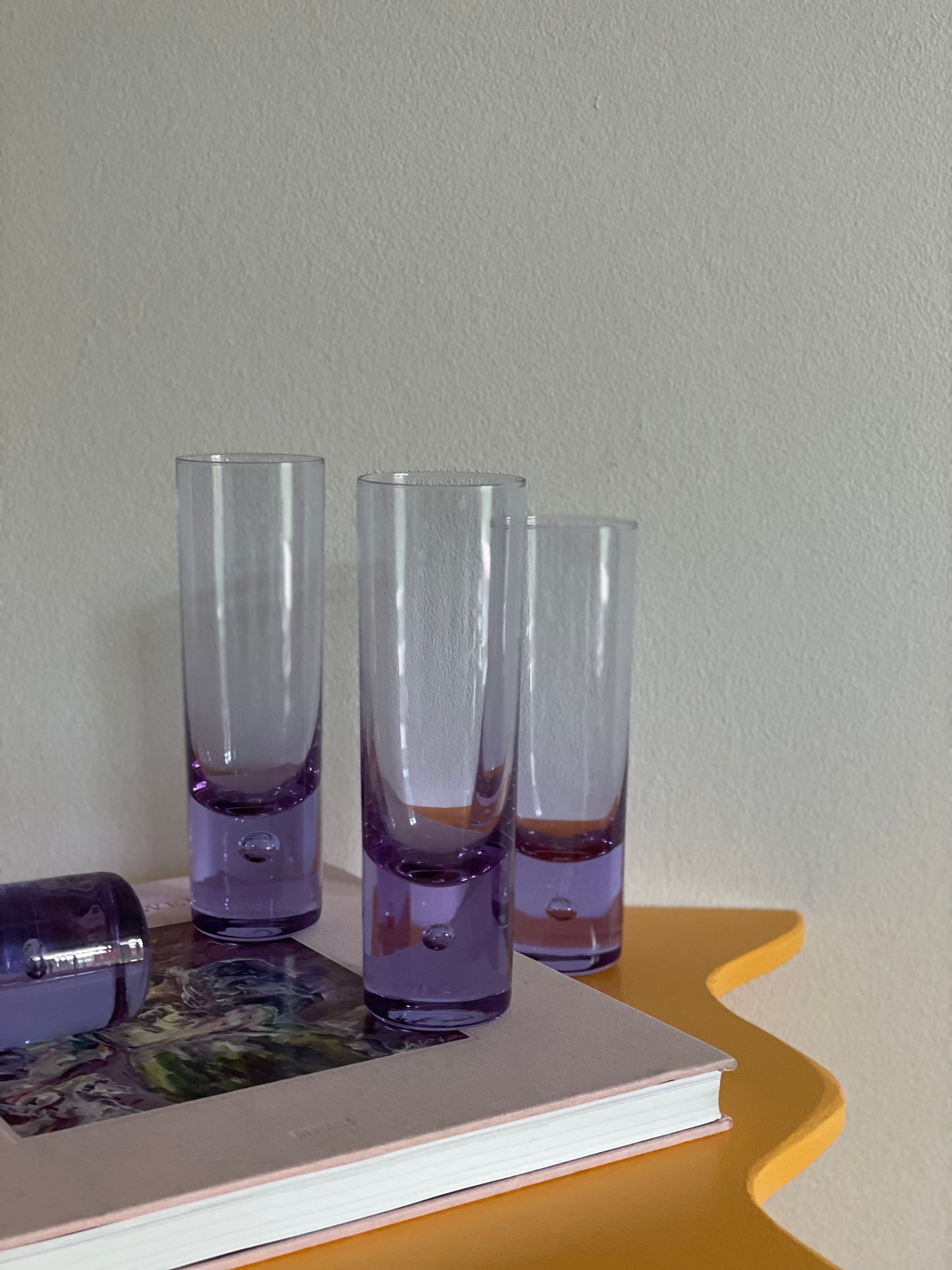 4 Tall purple glasses with bobble in the base