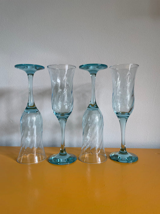 Light blue champagne glass with swirl